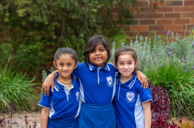 Group photo of three Marayong South students smiling for a picture.